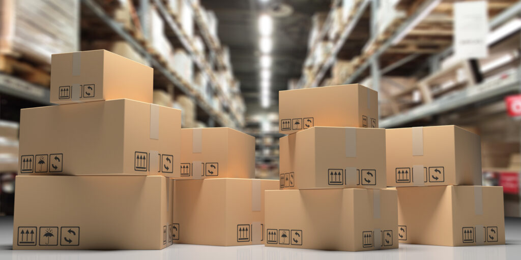 Cardboard boxes on blur storage warehouse