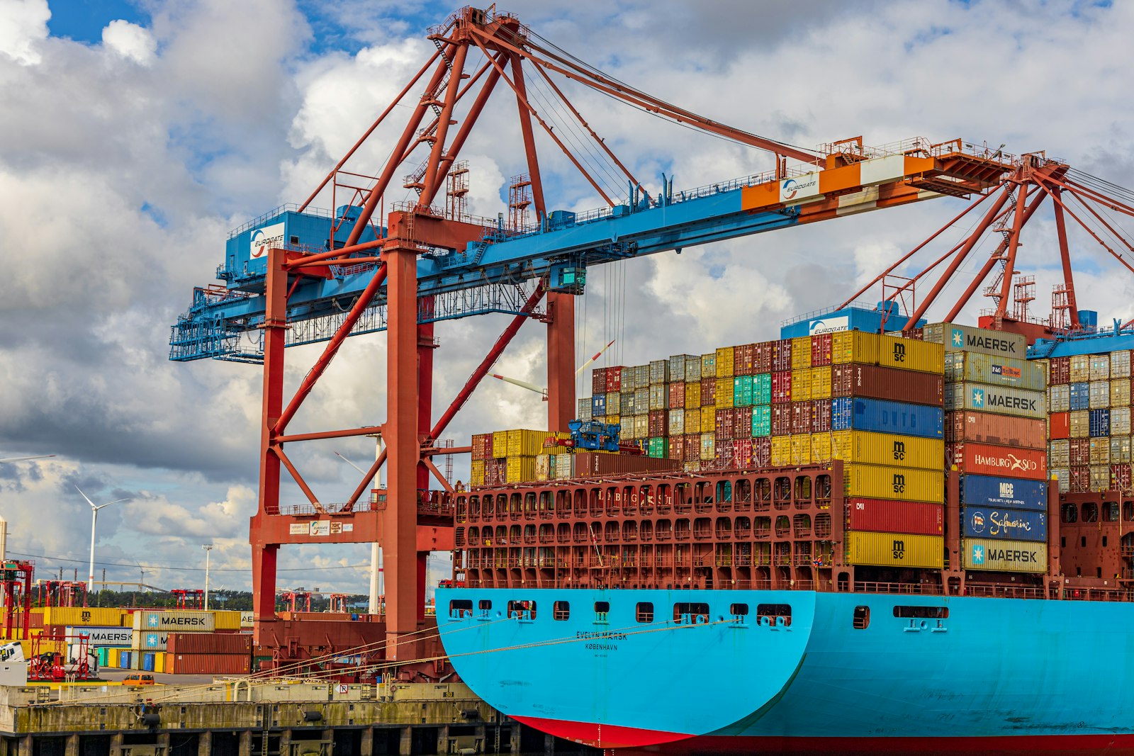 Intermodal shipping containers handled by gantry cranes, representing Dallas inland intermodal freight