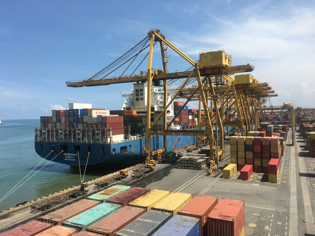 Container ship at a working port terminal handling ocean freight from China to Australia