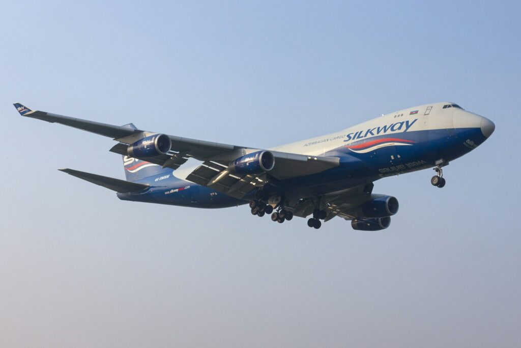 Large cargo freighter aircraft carrying air freight from the USA to Saudi Arabia