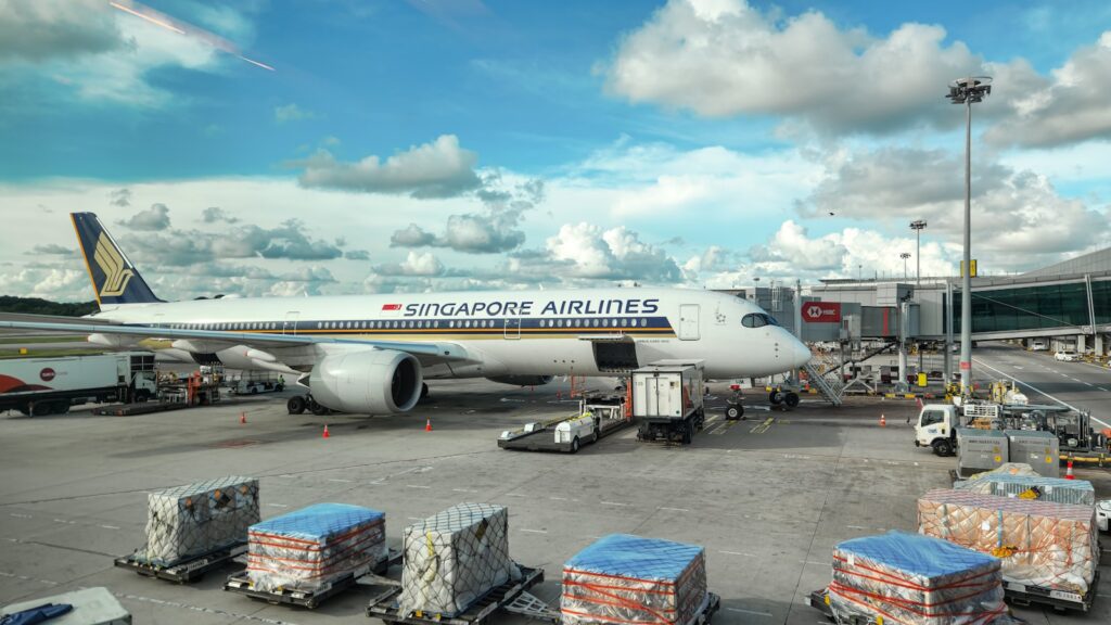 Large cargo aircraft on the airport tarmac, USA to Singapore air freight lane