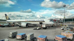 Large cargo aircraft on the airport tarmac, USA to Singapore air freight lane