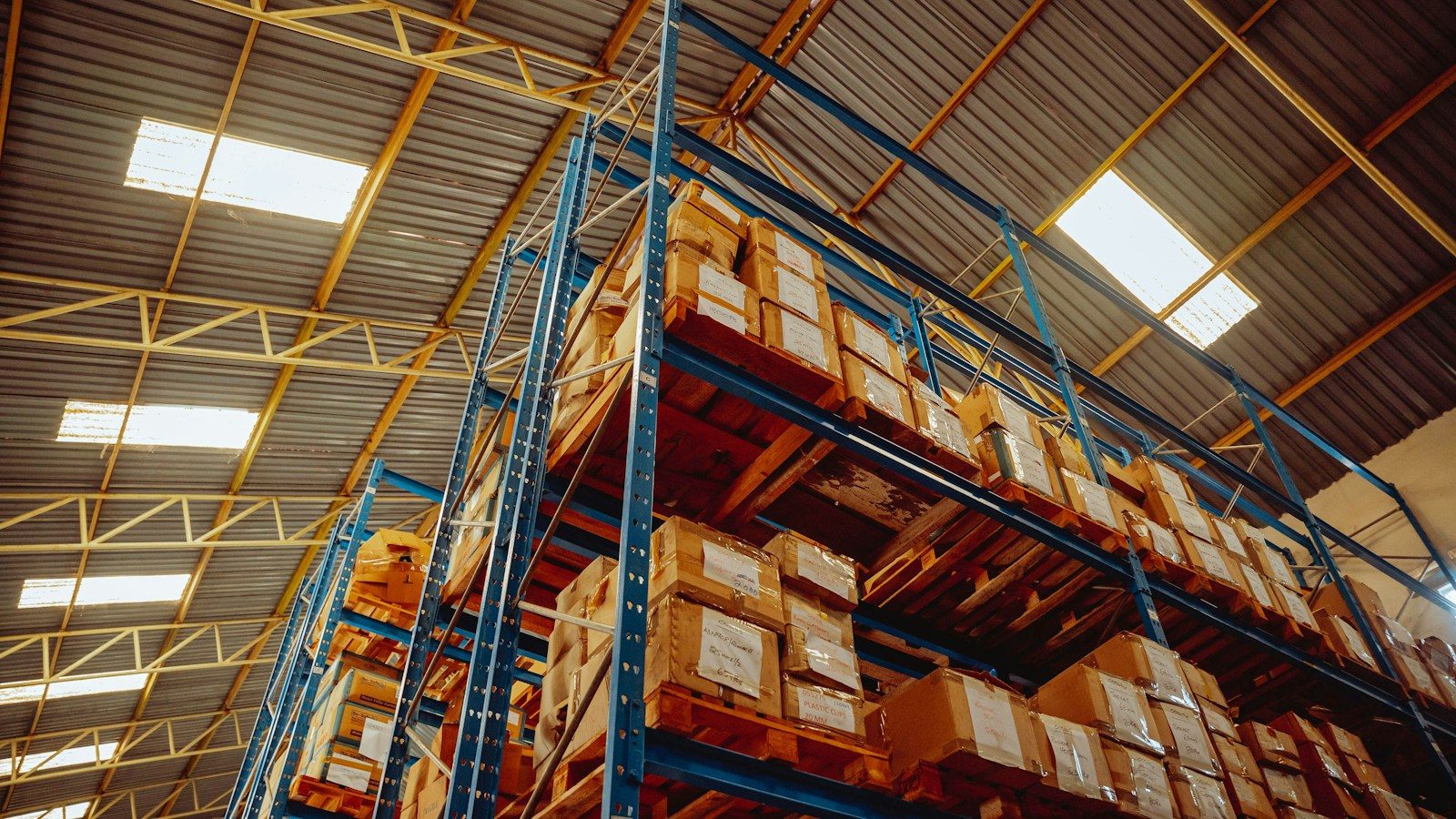 Palletized cartons stored on high pallet racking in a distribution warehouse